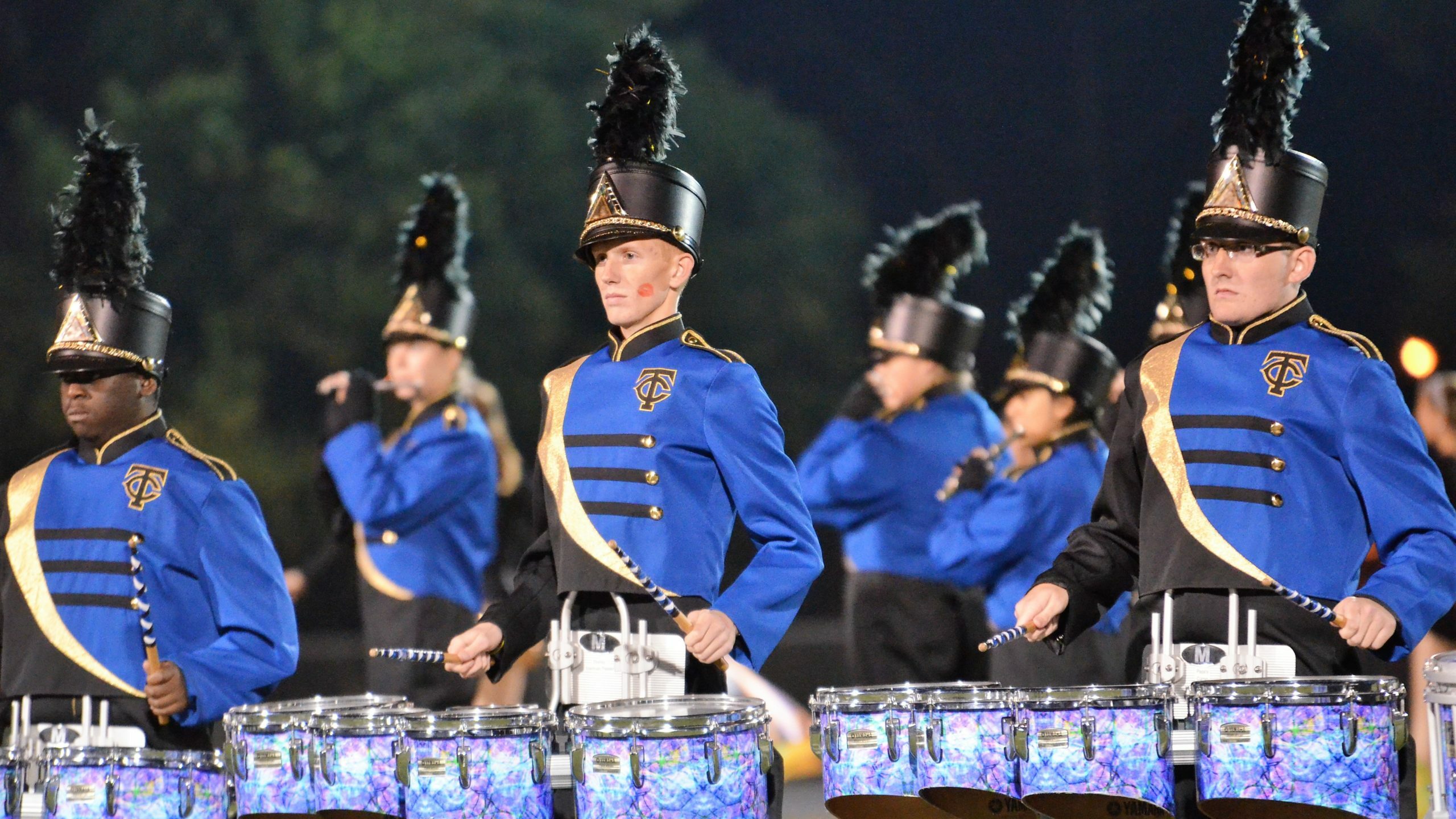 Marching Band squad in their uniforms performing